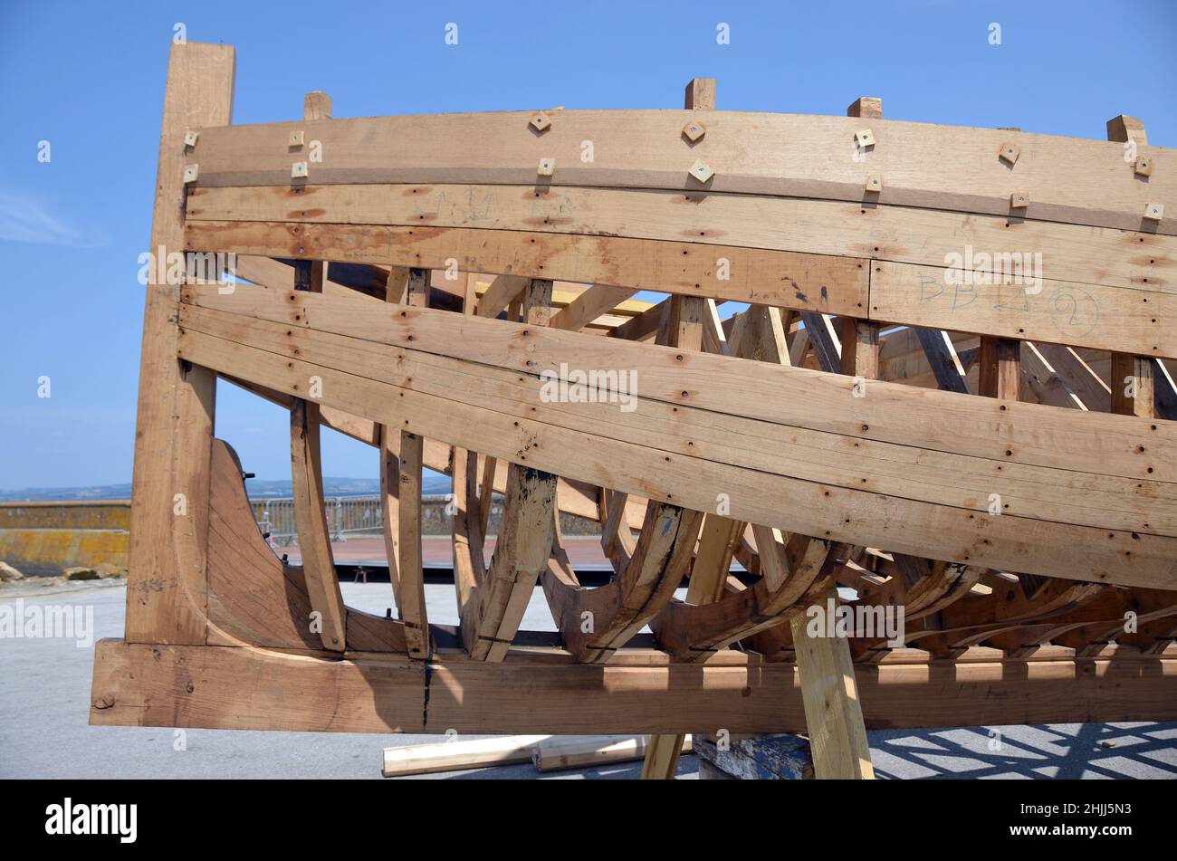 A classical wooden fishing boat in the final stage of construction