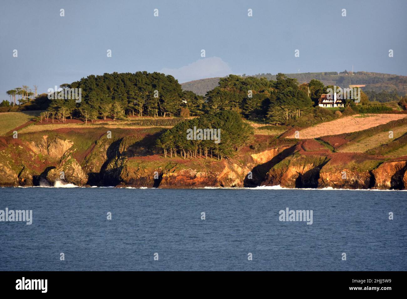 The coast near Douarnenez in Brittany. The summer evening makes colors to be warm. Stock Photo