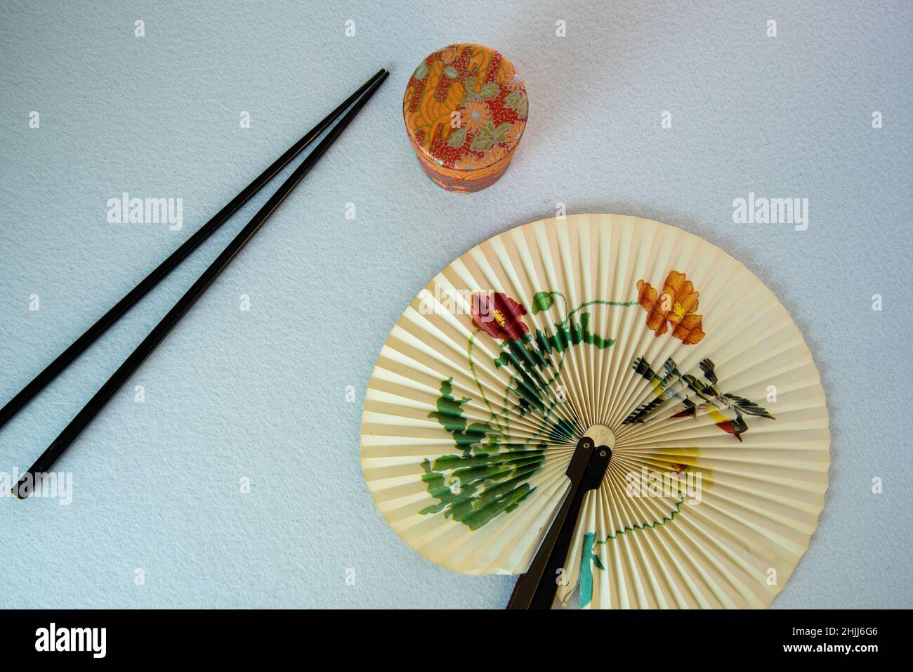 paper fan from far east with chop sticks Stock Photo