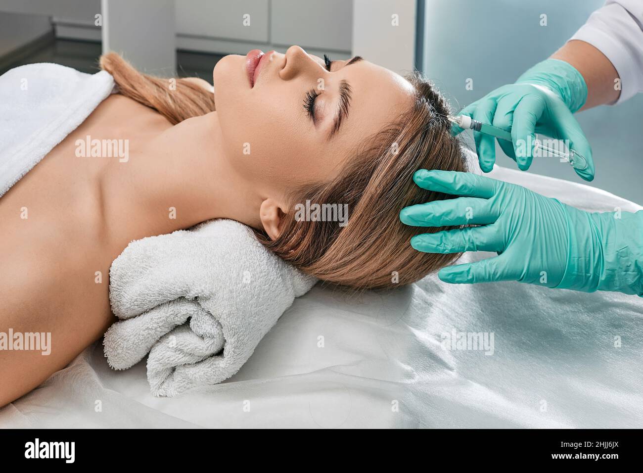 Injection for hair growth, treatment of hair loss. Woman getting