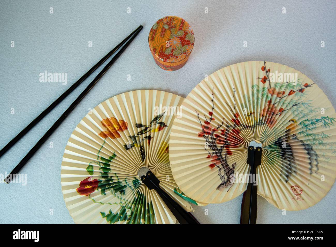 paper fan from far east with chop sticks Stock Photo