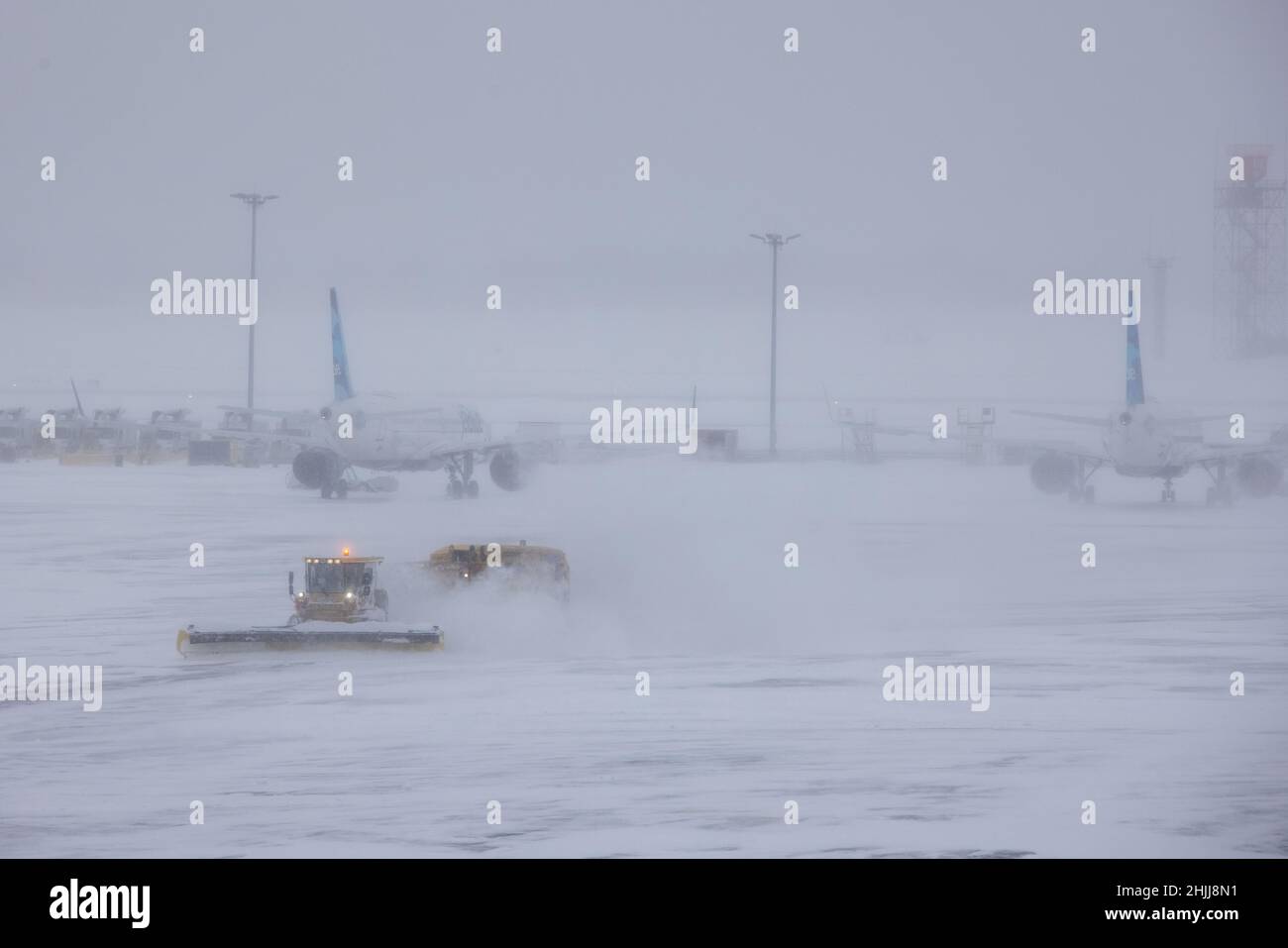 (220130) -- NEW YORK, Jan. 30, 2022 (Xinhua) -- Snow plows work at John F. Kennedy International Airport in New York, the United States, Jan. 29, 2022. Winter storm Kenan is bringing heavy snow and wind gusts to New York City and surrounding areas on Saturday. Snowfall at John F. Kennedy International Airport exceeded 5 inches in the last 12 hours, said a tweet from the National Weather Service at 9 a.m. on Saturday. As much as 460 flights from John F. Kennedy International Airport were canceled accounting for 80 percent of the total, according to travel information platform flightaware.c Stock Photo