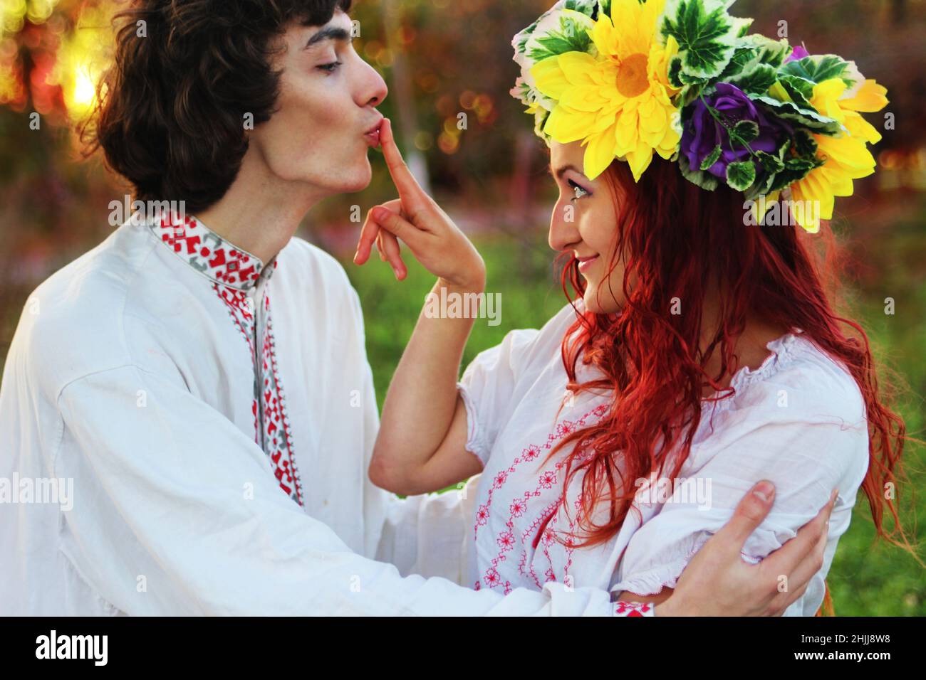 couple in love in national costumes, europe, traditional costumes for a wedding in eastern europe, a wreath on a girl's head, wedding Stock Photo