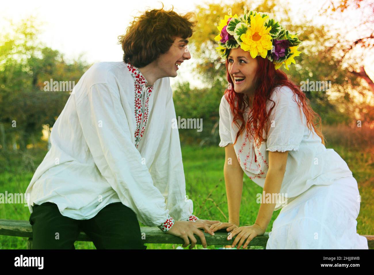 couple in love in national costumes, europe, traditional costumes for a wedding in eastern europe, a wreath on a girl's head, wedding Stock Photo