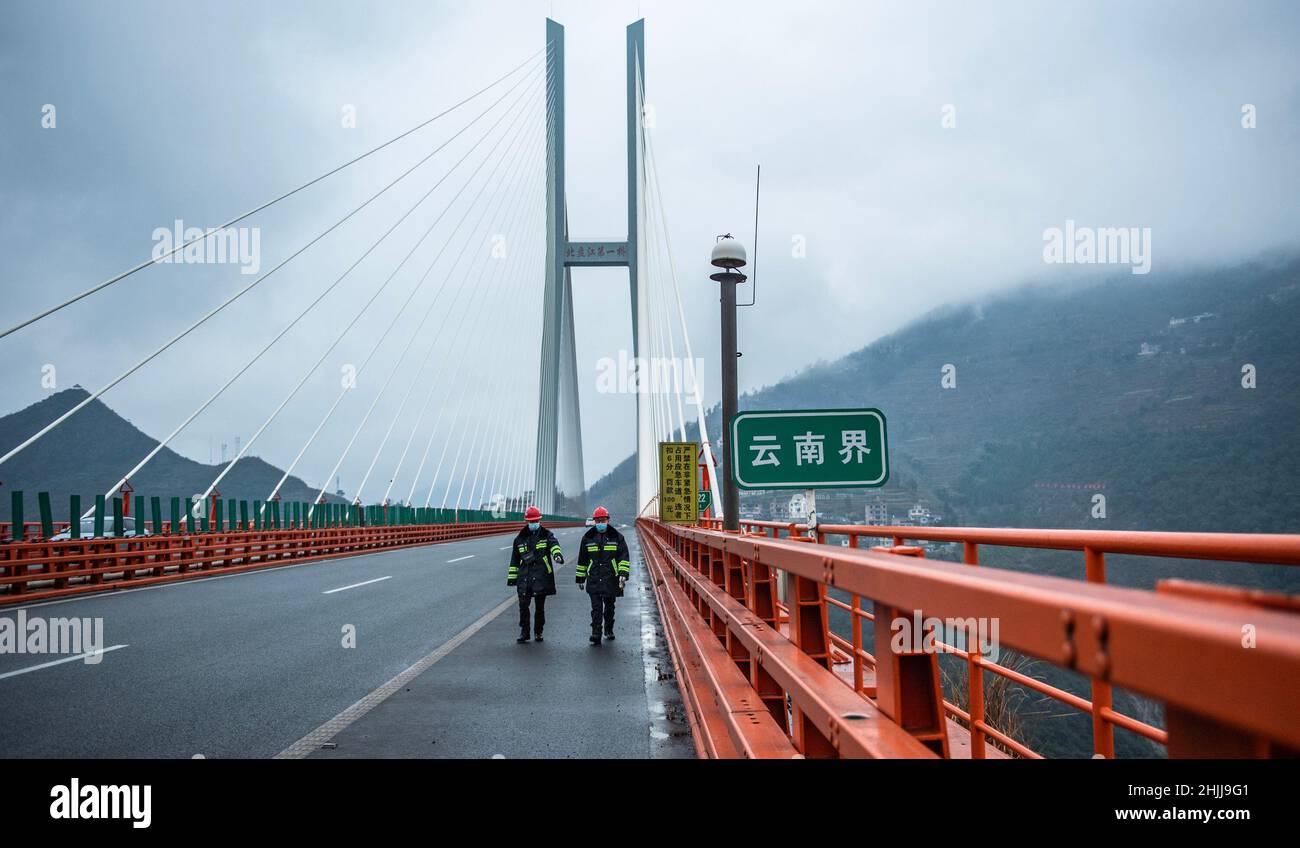 Liupanshui. 29th Jan, 2022. Maintenance workers carry out an inspection on the Beipanjiang Bridge in southwest China's Guizhou Province, Jan. 29, 2022. Sitting over 565.4 meters above a valley, the Beipanjiang Bridge has been certified as the world's highest bridge by the Guinness World Records. Spanning 1,341.4 meters, the bridge links Duge Township of Liupanshui in southwest China's Guizhou with Puli Township of Xuanwei in southwest China's Yunnan Province. Credit: Tao Liang/Xinhua/Alamy Live News Stock Photo