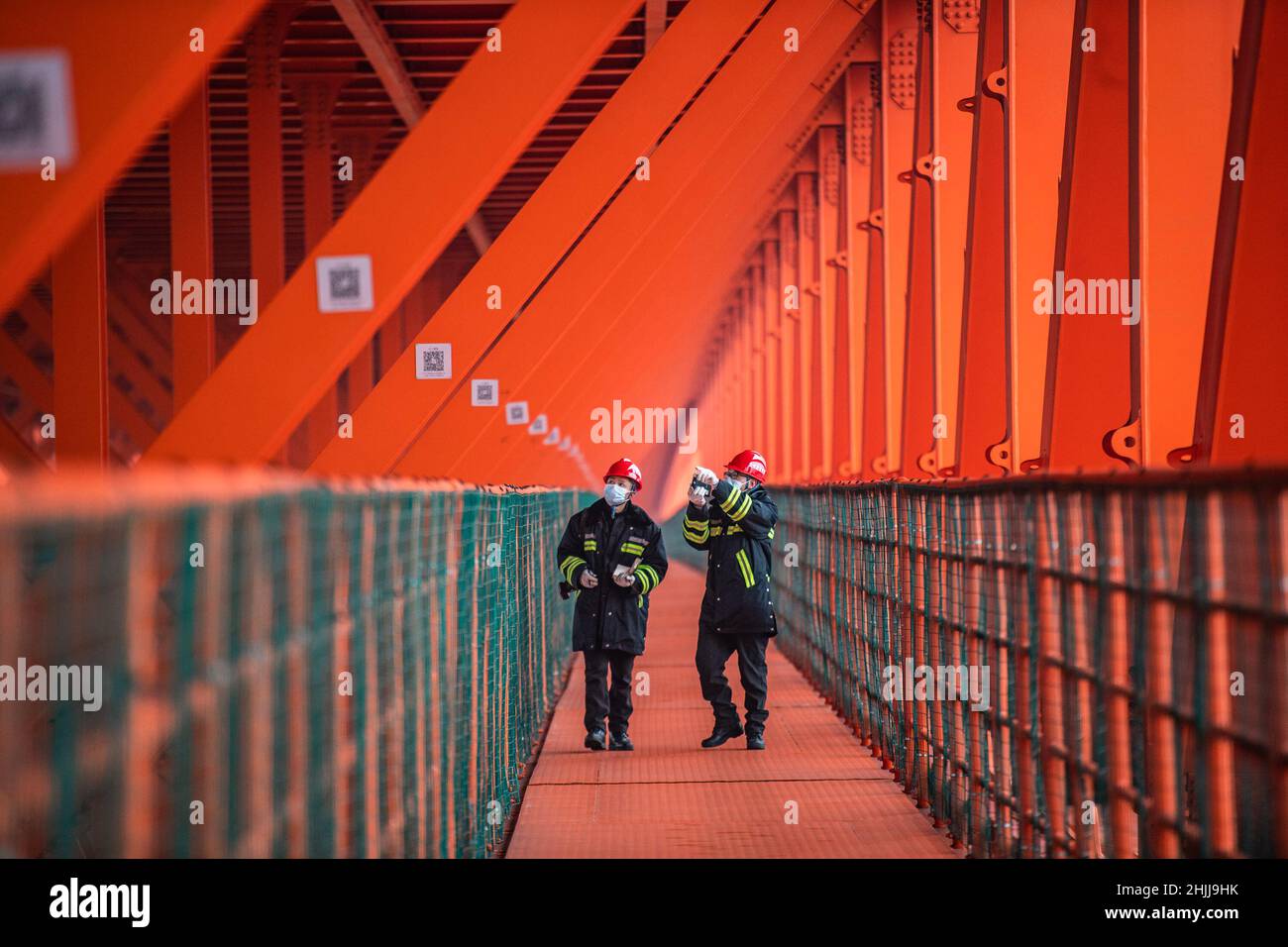 Liupanshui. 29th Jan, 2022. Maintenance workers examine the interior of the Beipanjiang Bridge in southwest China's Guizhou Province, Jan. 29, 2022. Sitting over 565.4 meters above a valley, the Beipanjiang Bridge has been certified as the world's highest bridge by the Guinness World Records. Spanning 1,341.4 meters, the bridge links Duge Township of Liupanshui in southwest China's Guizhou with Puli Township of Xuanwei in southwest China's Yunnan Province. Credit: Tao Liang/Xinhua/Alamy Live News Stock Photo