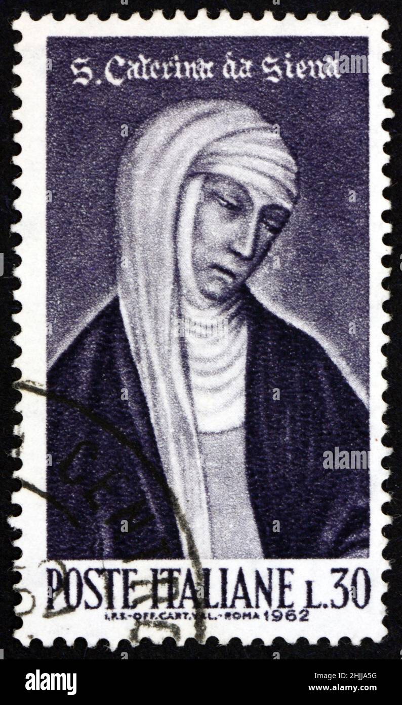 ITALY - CIRCA 1962: a stamp printed in Italy shows St. Catherine of Siena, painting by Andrea Vanni, 500th anniversary of the canonization of St. Cath Stock Photo