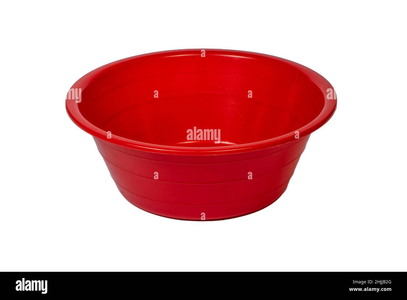 Red plastic wash bowl cut out isolated on white background Stock Photo