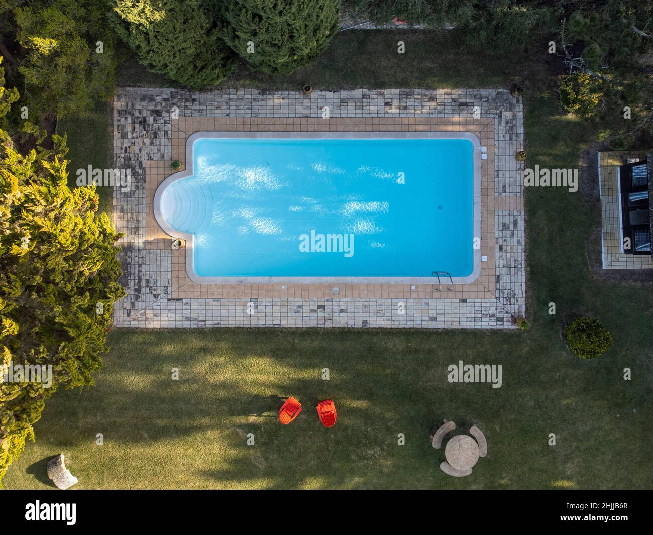 Aerial view of an outdoor swimming pool in the garden of a private house Stock Photo