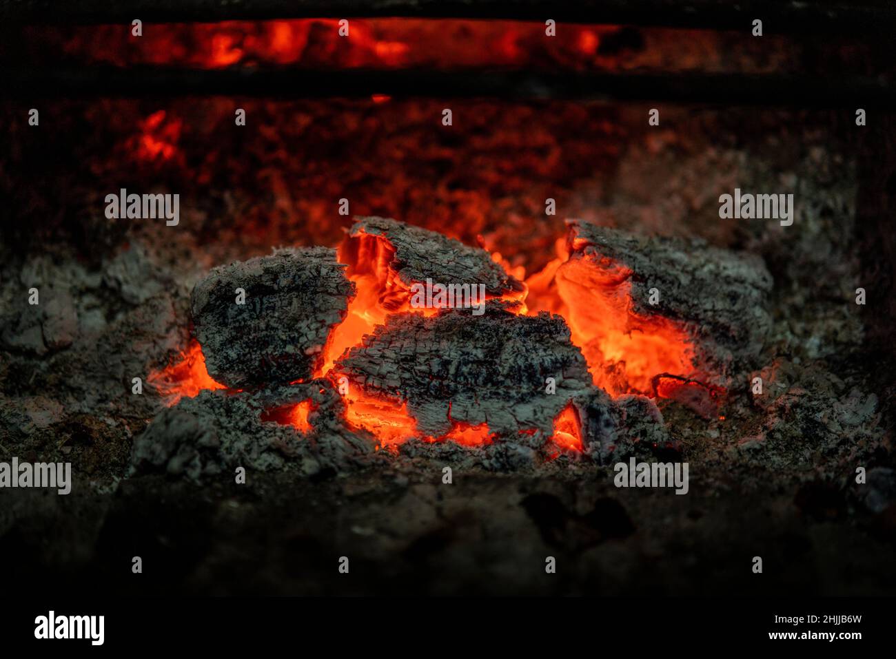 Glowing embers in a wood fire on a fireplace Stock Photo