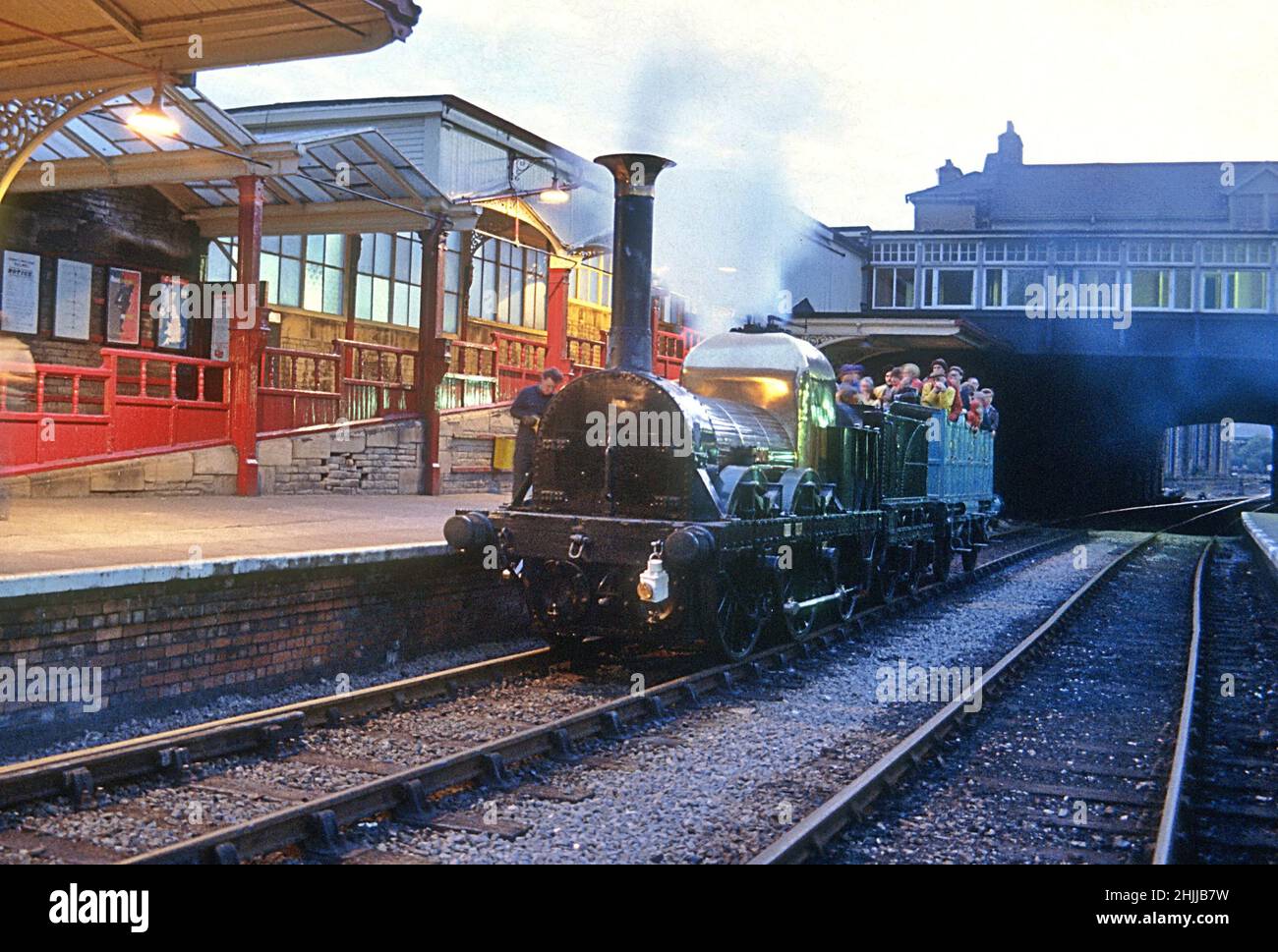 1838 Liverpool and Manchester Railway 0-4-2 Lion departing Keighley station in 1981with a evening train for Haworth Stock Photo