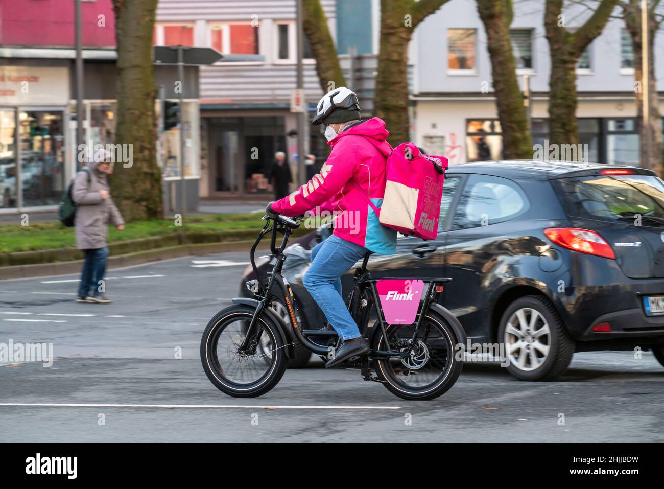 Bicycle courier of the fast delivery service Flink, delivers groceries