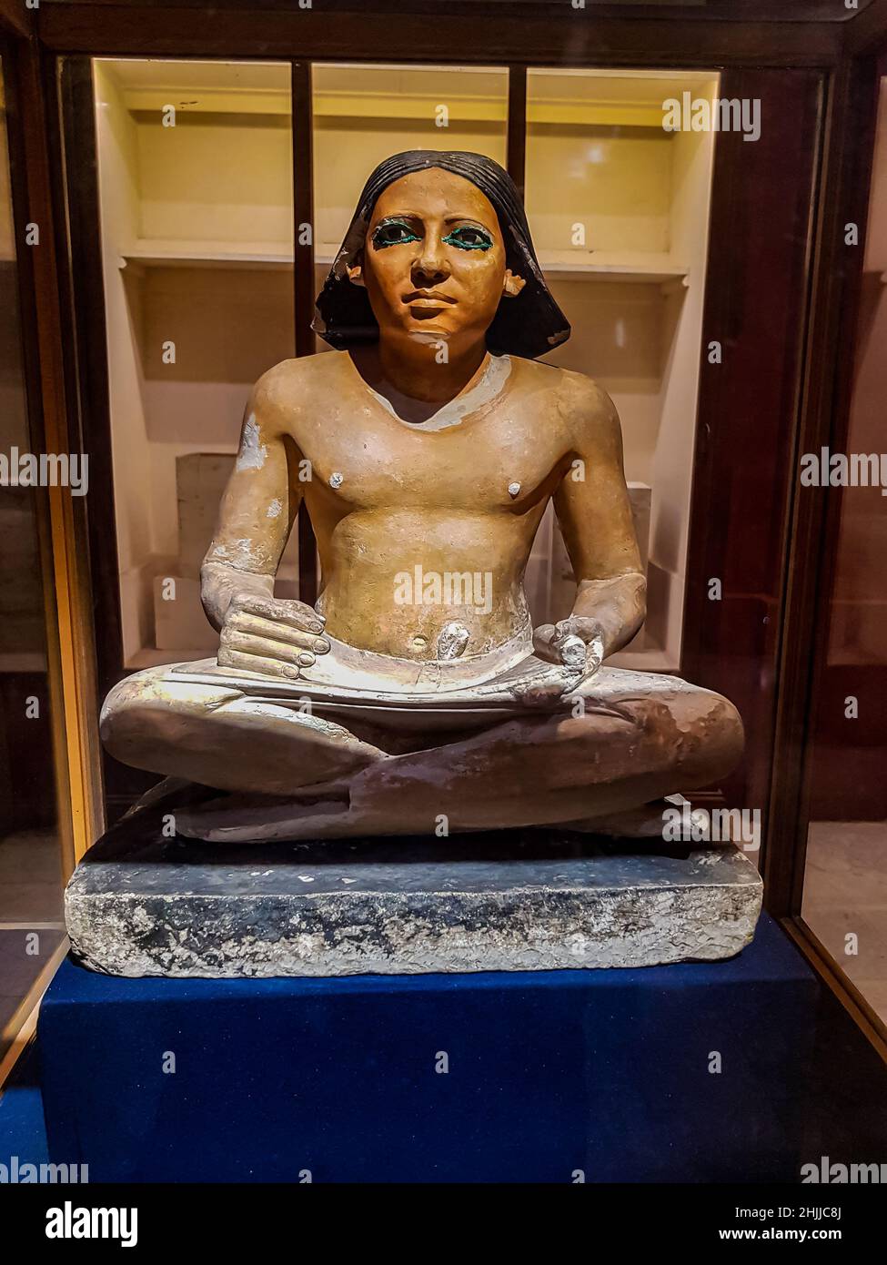 Statue of ancient Egyptian seated scribe from Egyptian Museum in Cairo, Egypt. Stock Photo
