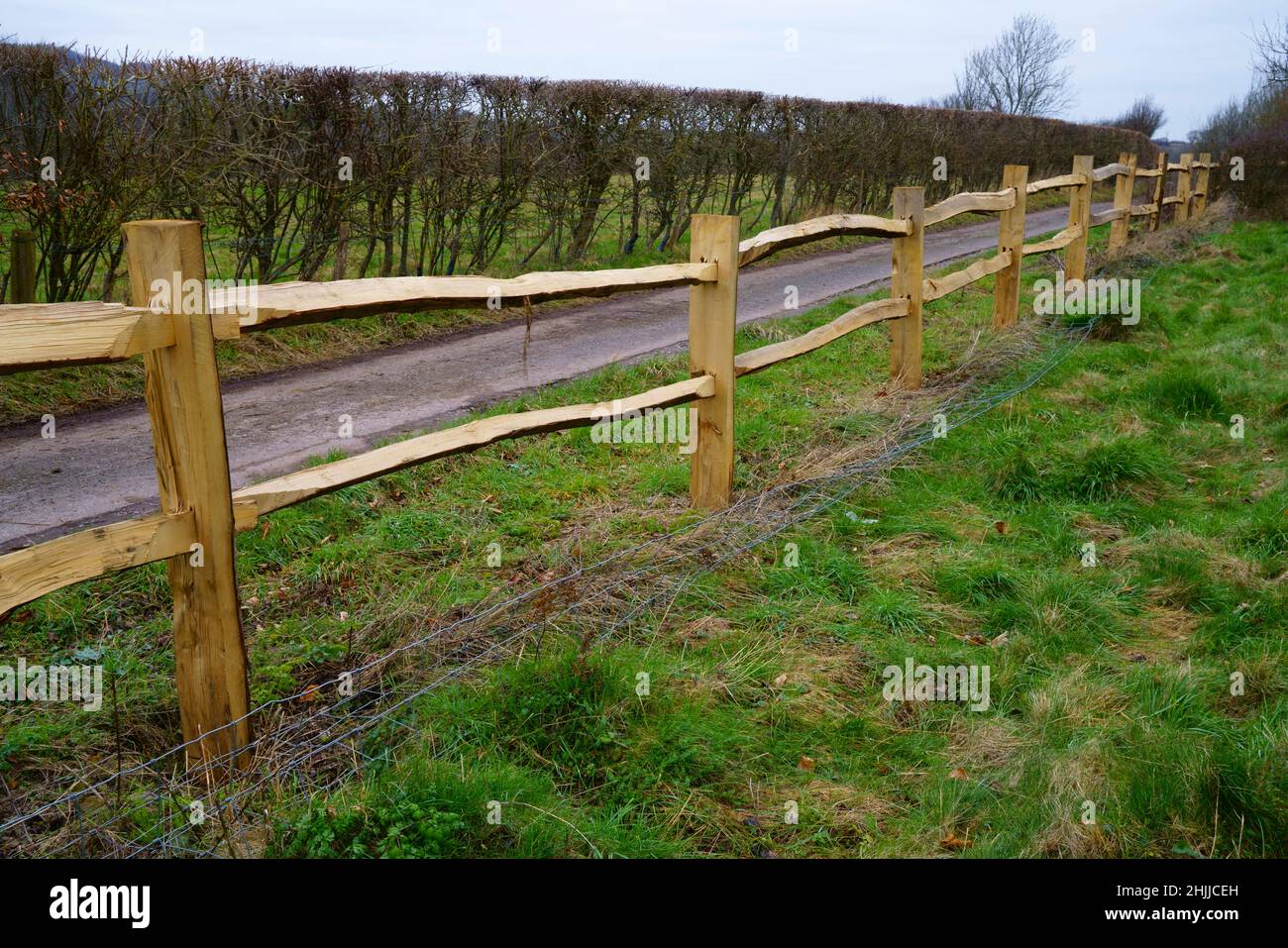 A brand new Chestnut post and rail fence. Stock Photo
