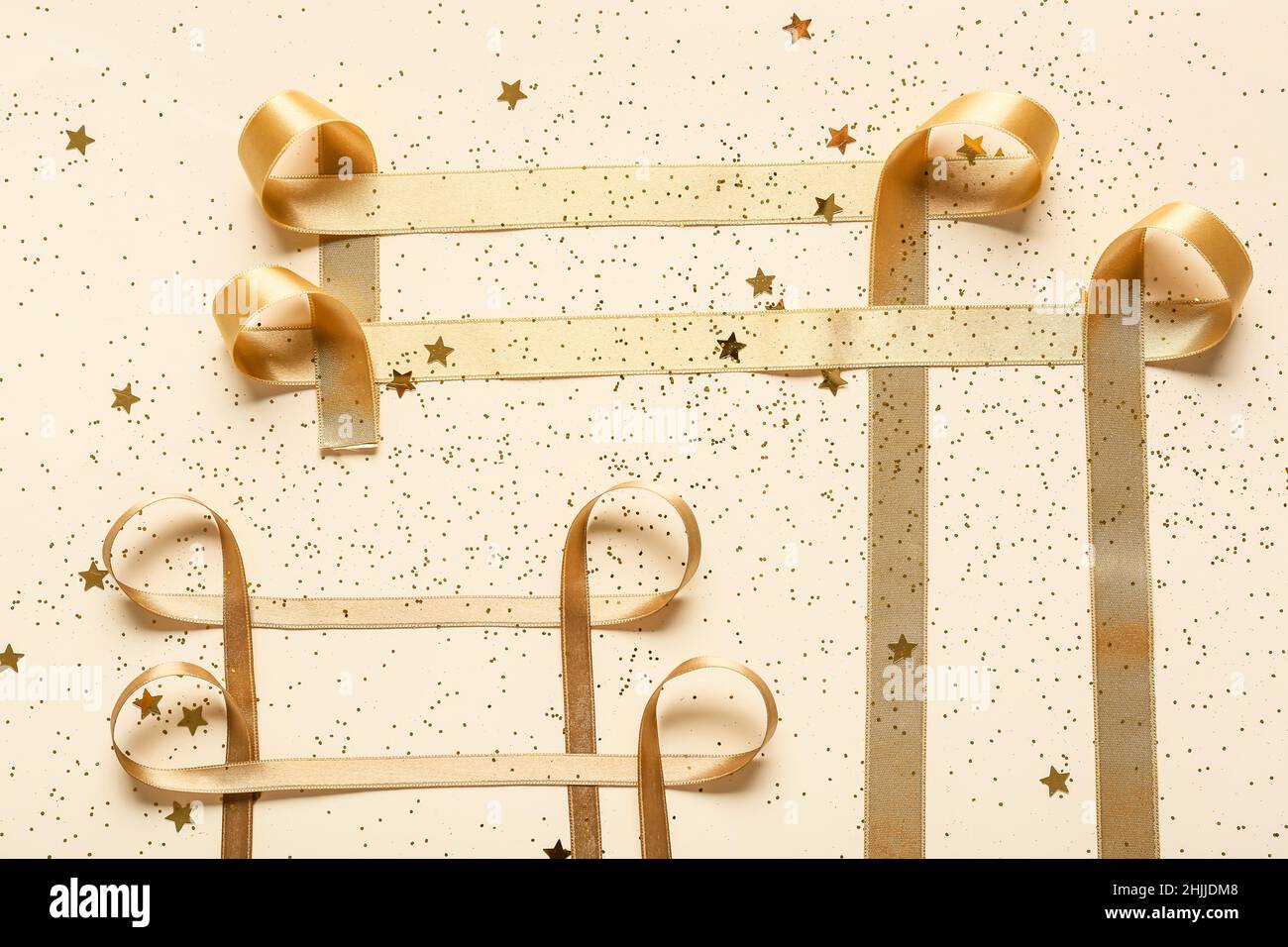 Gold confetti stars ribbons hi-res stock photography and images - Alamy