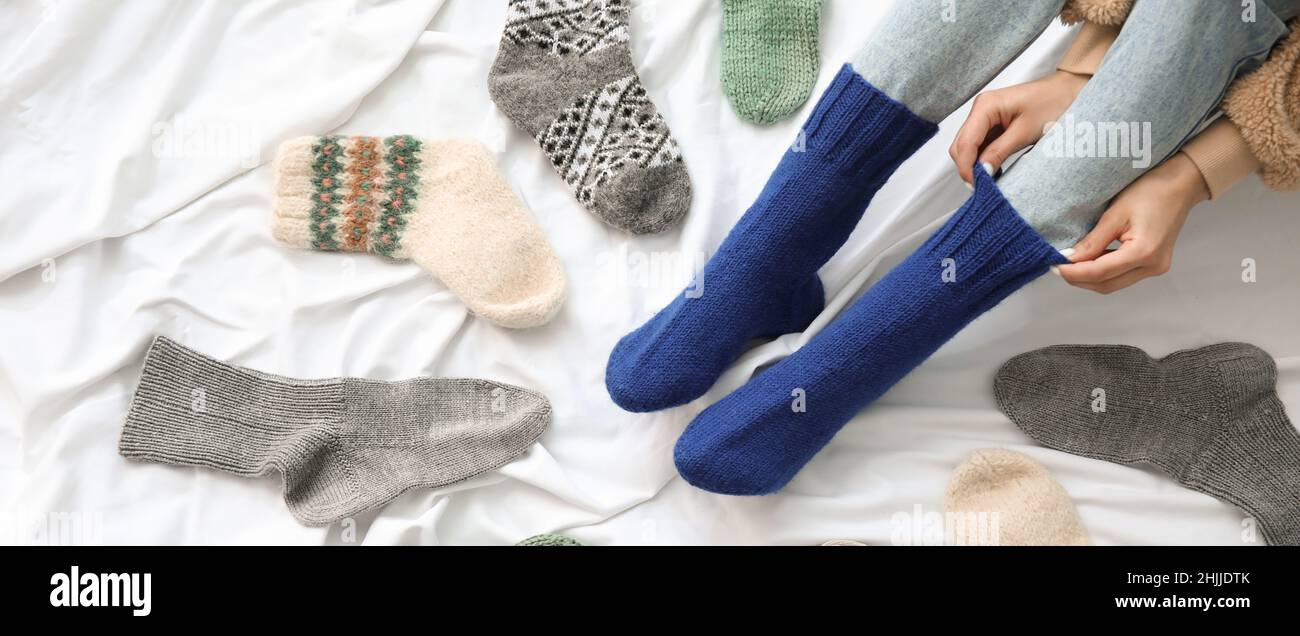 Girl putting socks on bed hi-res stock photography and images - Alamy
