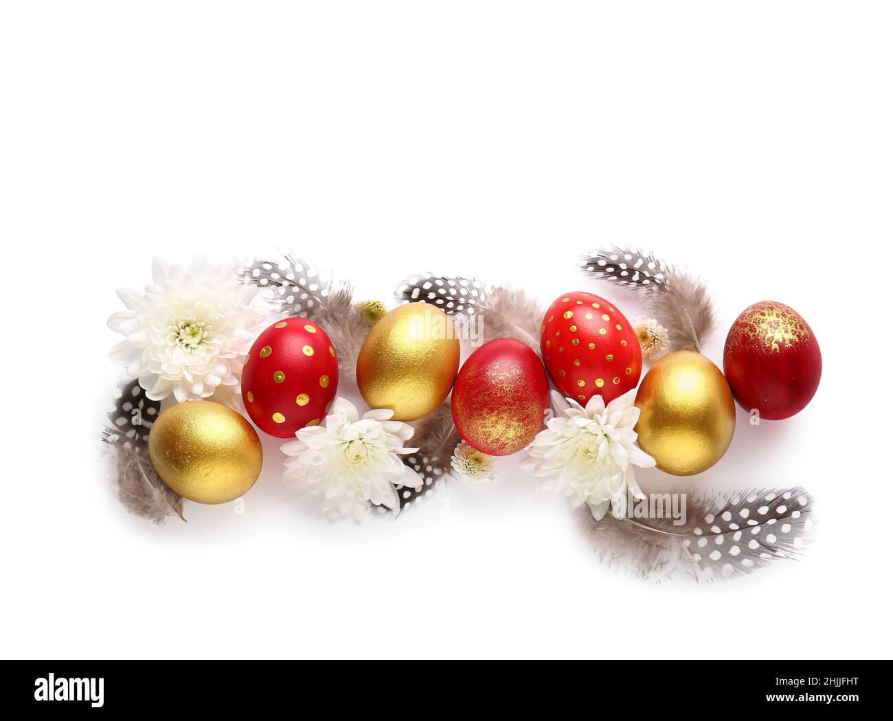 Stylish Easter eggs, flowers and feathers on white background Stock Photo