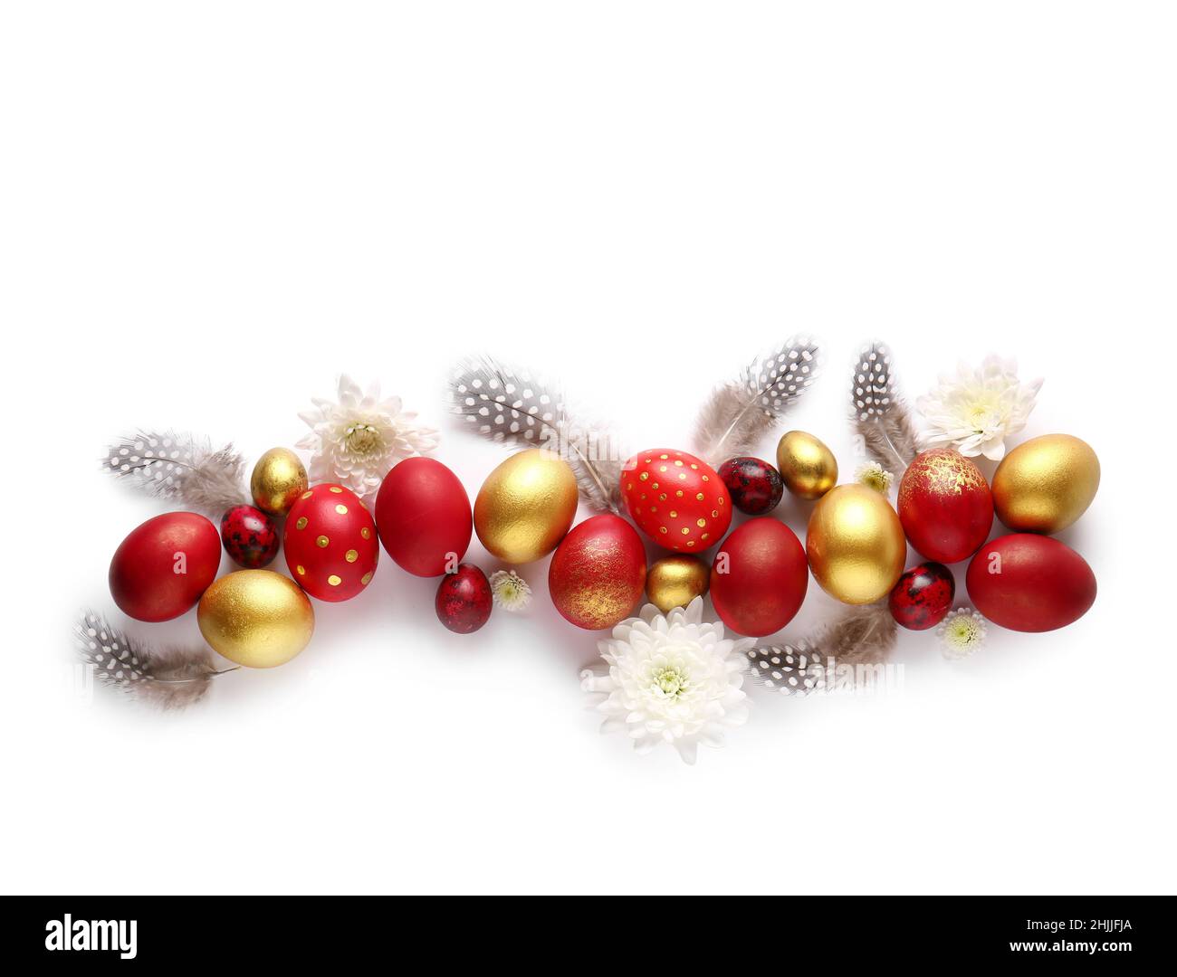 Stylish Easter eggs, flowers and feathers on white background Stock Photo