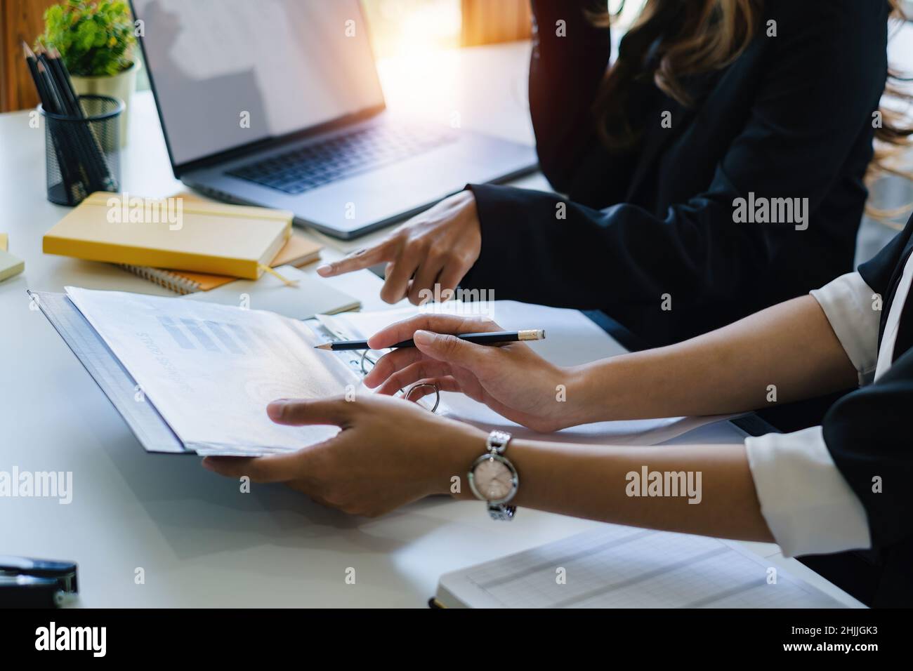 Asian Business team sharing ideas and consult together at meeting room. Financial advisor and accounting concept. Stock Photo