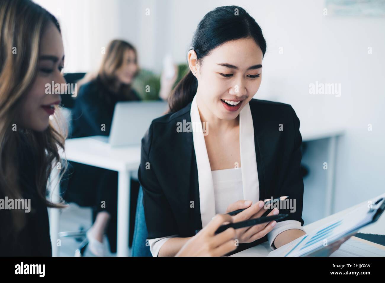 Asian Business team sharing ideas and consult together at meeting room. Financial advisor and accounting concept. Stock Photo
