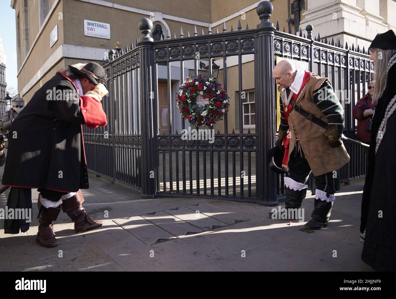 Members of the King's Army of the English Civil War Society lay a wreath outside Banqueting House - the site of King Charles I's execution on 30 January 1649 - after taking part in an annual march down The Mall in London, to commemorate his execution. Picture date: Sunday January 30, 2022. Stock Photo