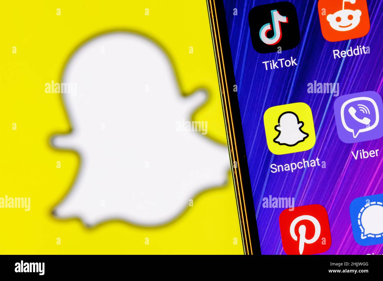 The icon of the Snapchat instant messaging service application among other applications on the smartphone screen. Stock Photo