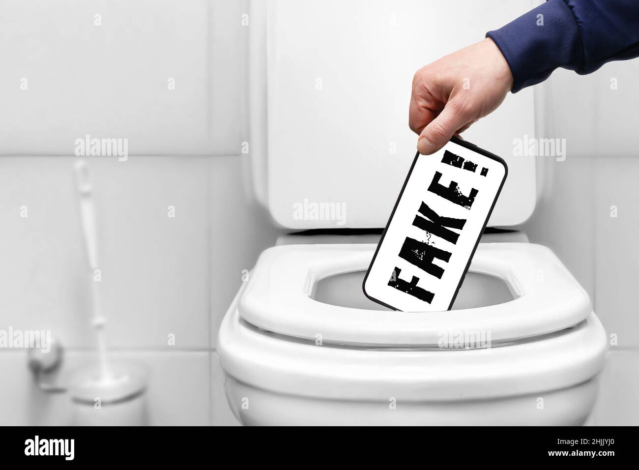 fake word on the smartphone screen a person throws a smartphone phone