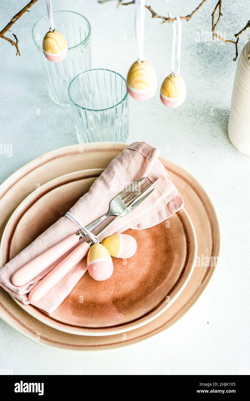 Overhead view of an Easter place setting with painted Easter egg decorations Stock Photo