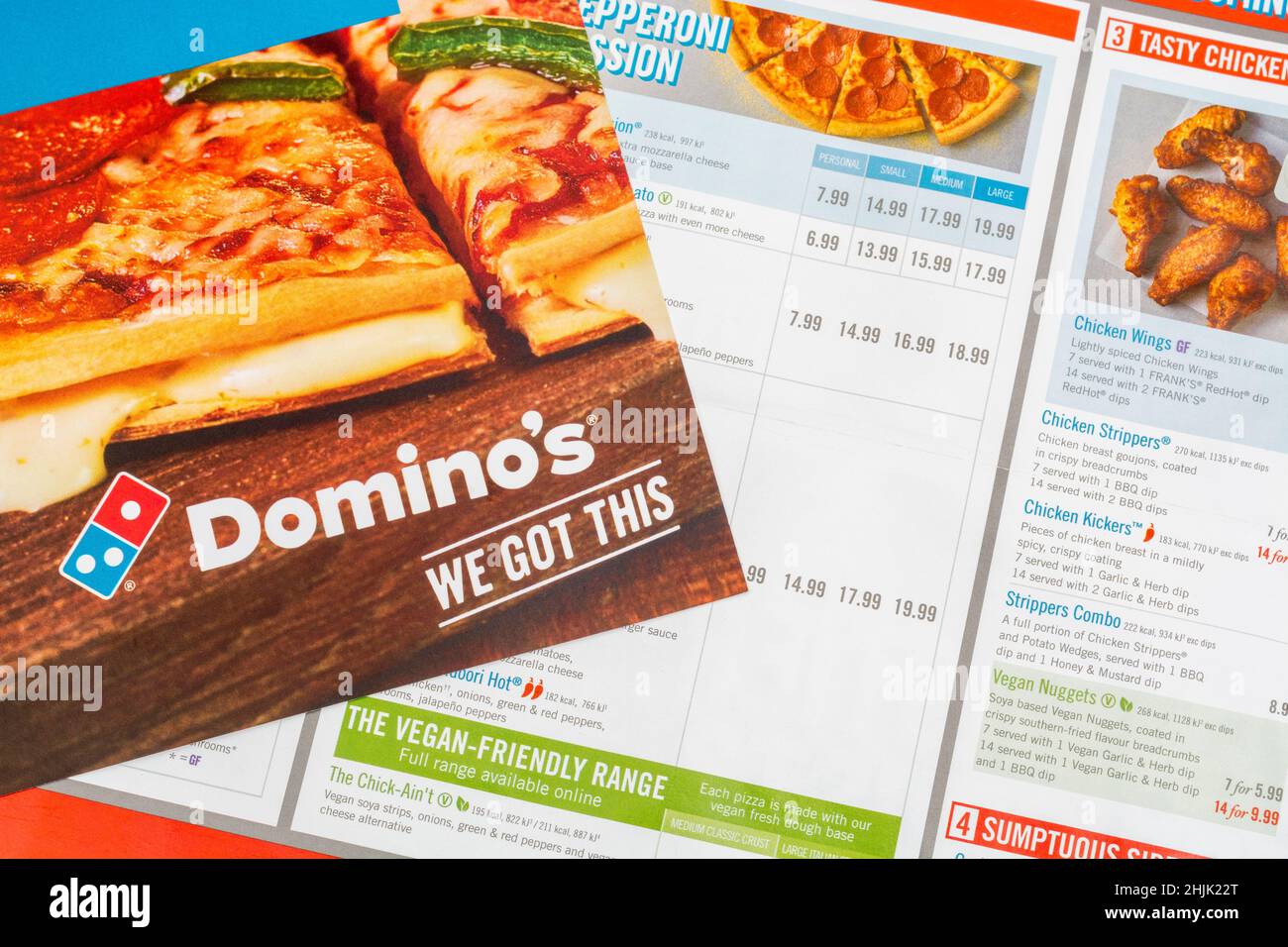 UK Domino's Pizza direct marketing leaflet from mailbox drop, and featuring  Domino's logo and pricing list. Covid UK food buying habits Stock Photo -  Alamy
