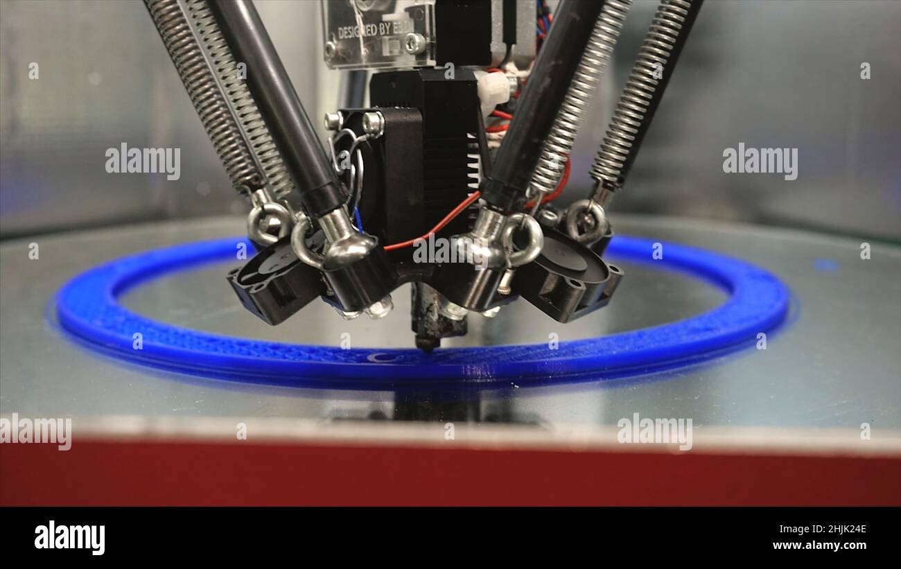 3d printing printer bright model close-up. Media. Automatic 3D printer performs plastic modeling in laboratory. Modern additive technologies, industri Stock Photo
