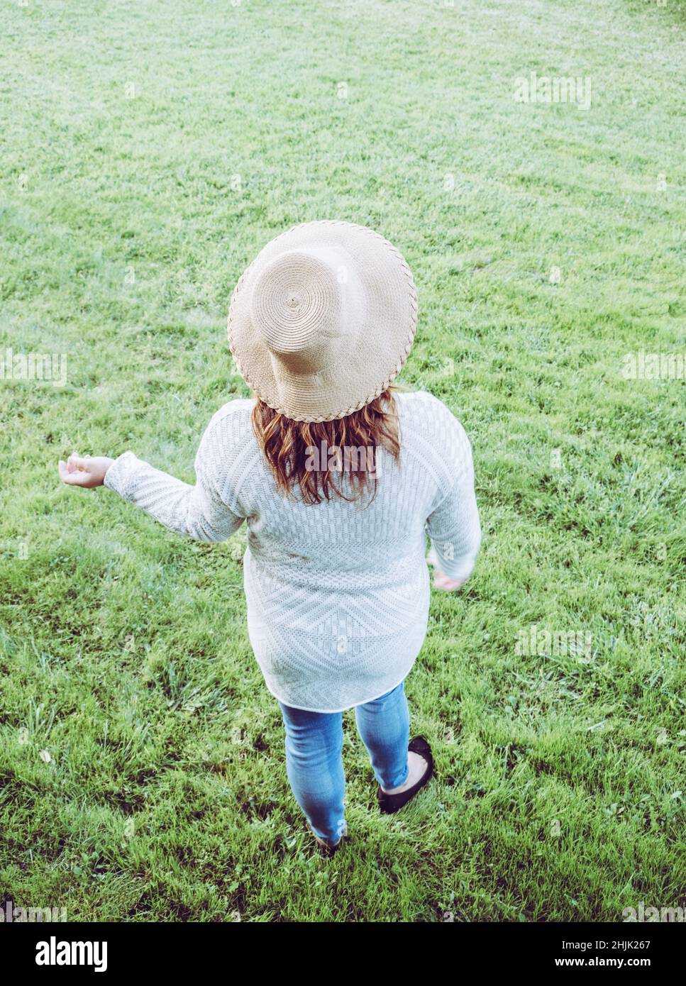 Woman hair hand rear view one person hi-res stock photography and ...