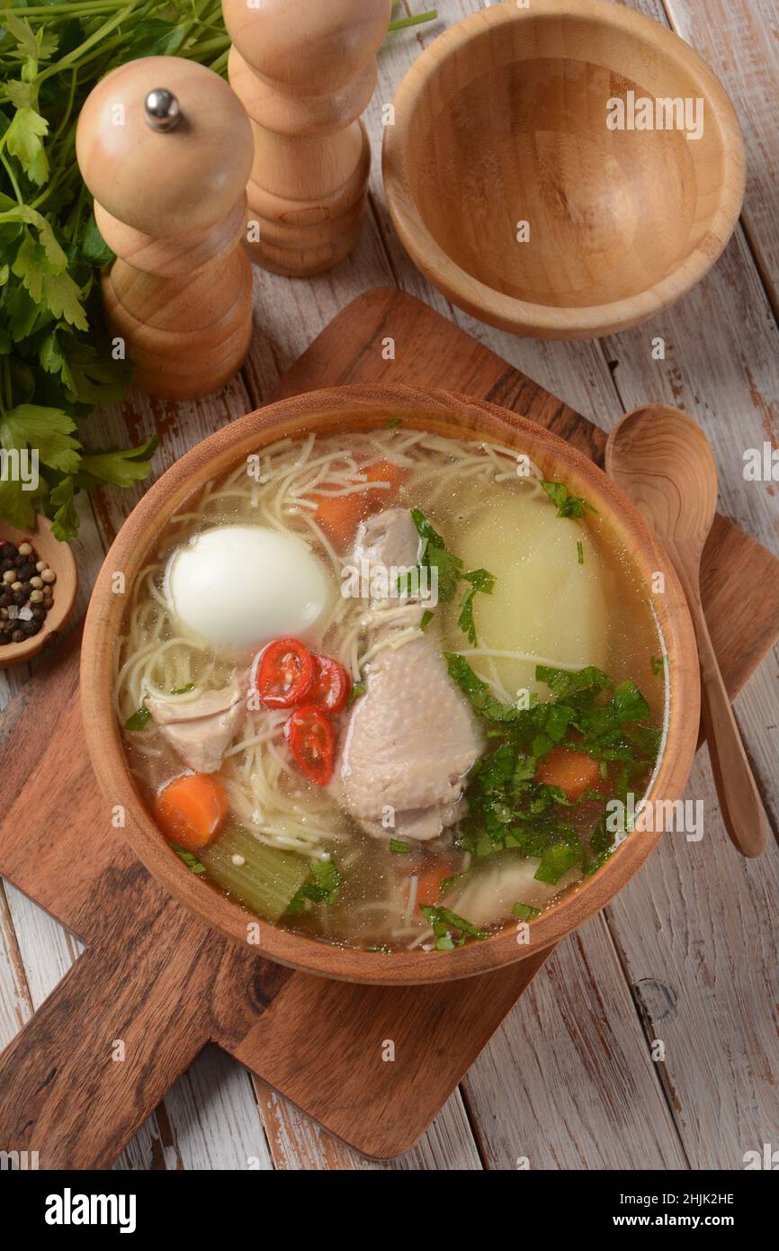 South American Caldo de Gallina chicken noodle soup with boiled egg and