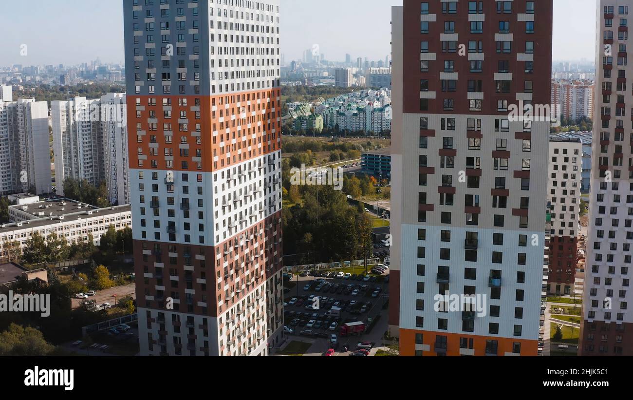 Picture of Top view of multi-colored residential complexes in city. Action ...