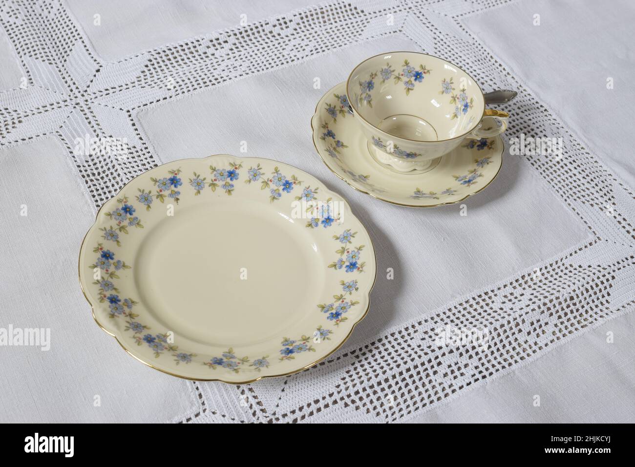 1950s coffee set on white lace tablecloth Stock Photo