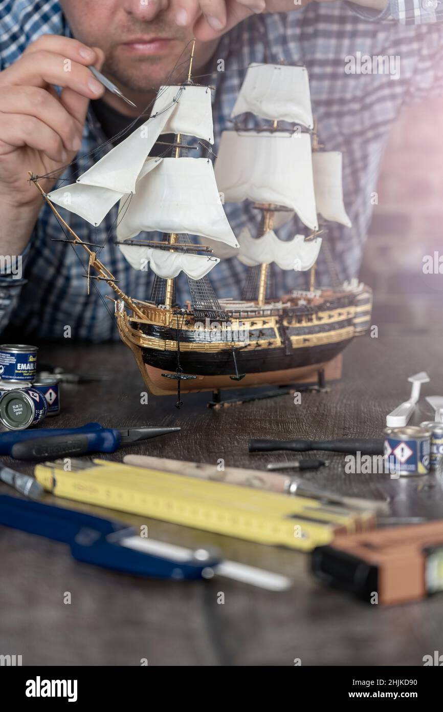 Model Ship Building handcraft on table with different materials Stock Photo