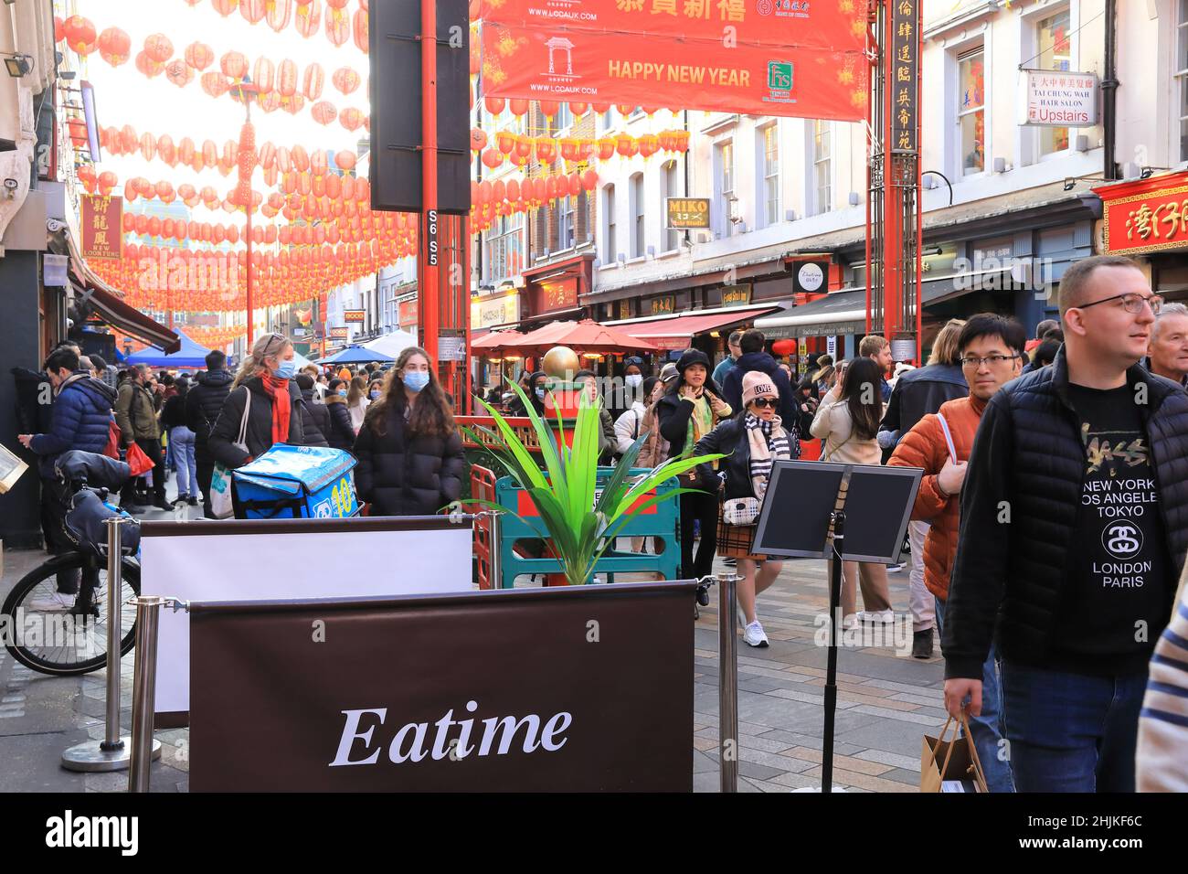 London, UK, January 30th 2022. Despite the usual parade being cancelled again due to Covid worries, people flocked to China  Town in Soho for eating, shopping and relaxing in the winter sunshine on the Sunday before Chinese New Year, which will be on February 1st. Credit: MonicaWells/Alamy Live News Stock Photo