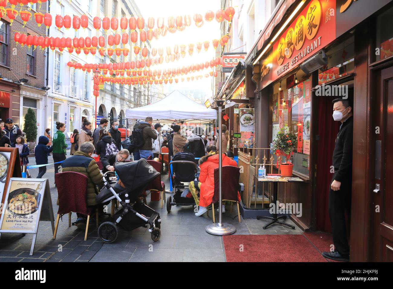 London, UK, January 30th 2022. Despite the usual parade being cancelled again due to Covid worries, people flocked to China  Town in Soho for eating, shopping and relaxing in the winter sunshine on the Sunday before Chinese New Year, which will be on February 1st. Credit: MonicaWells/Alamy Live News Stock Photo