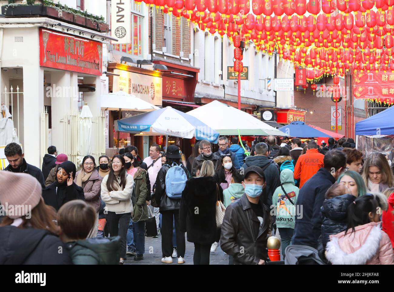 London, UK, January 30th 2022. Despite the usual parade being cancelled again due to Covid worries, people flocked to China  Town in Soho for eating, shopping and relaxing in the winter sunshine on the Sunday before Chinese New Year, which will be on February 1st. Credit: MonicaWells/Alamy Live News Stock Photo