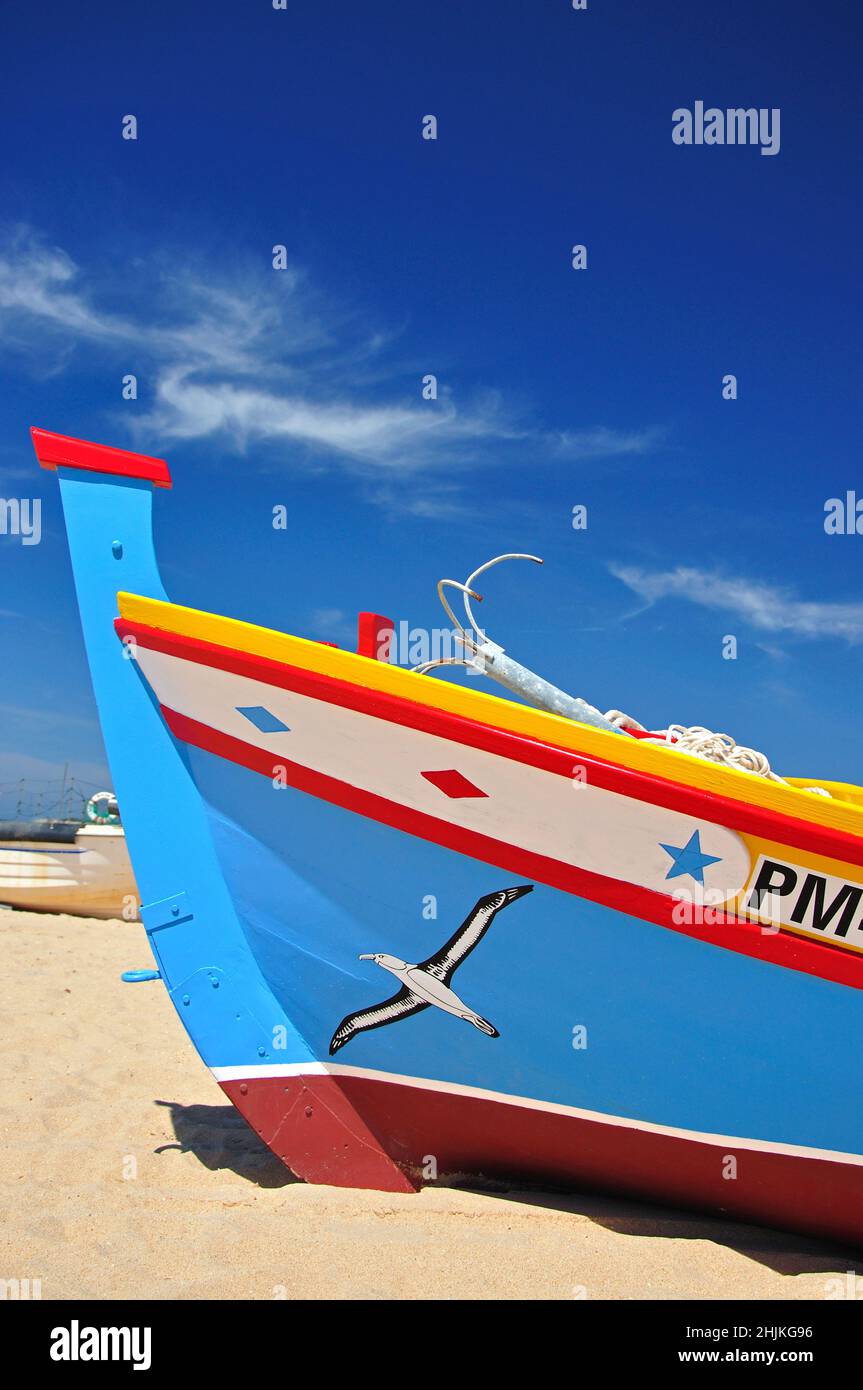 Colourful fishing boat on beach, Armação de Pêra, Algarve Region, Portugal Stock Photo