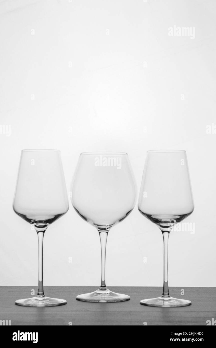 A set of various wine glasses in black and white Stock Photo