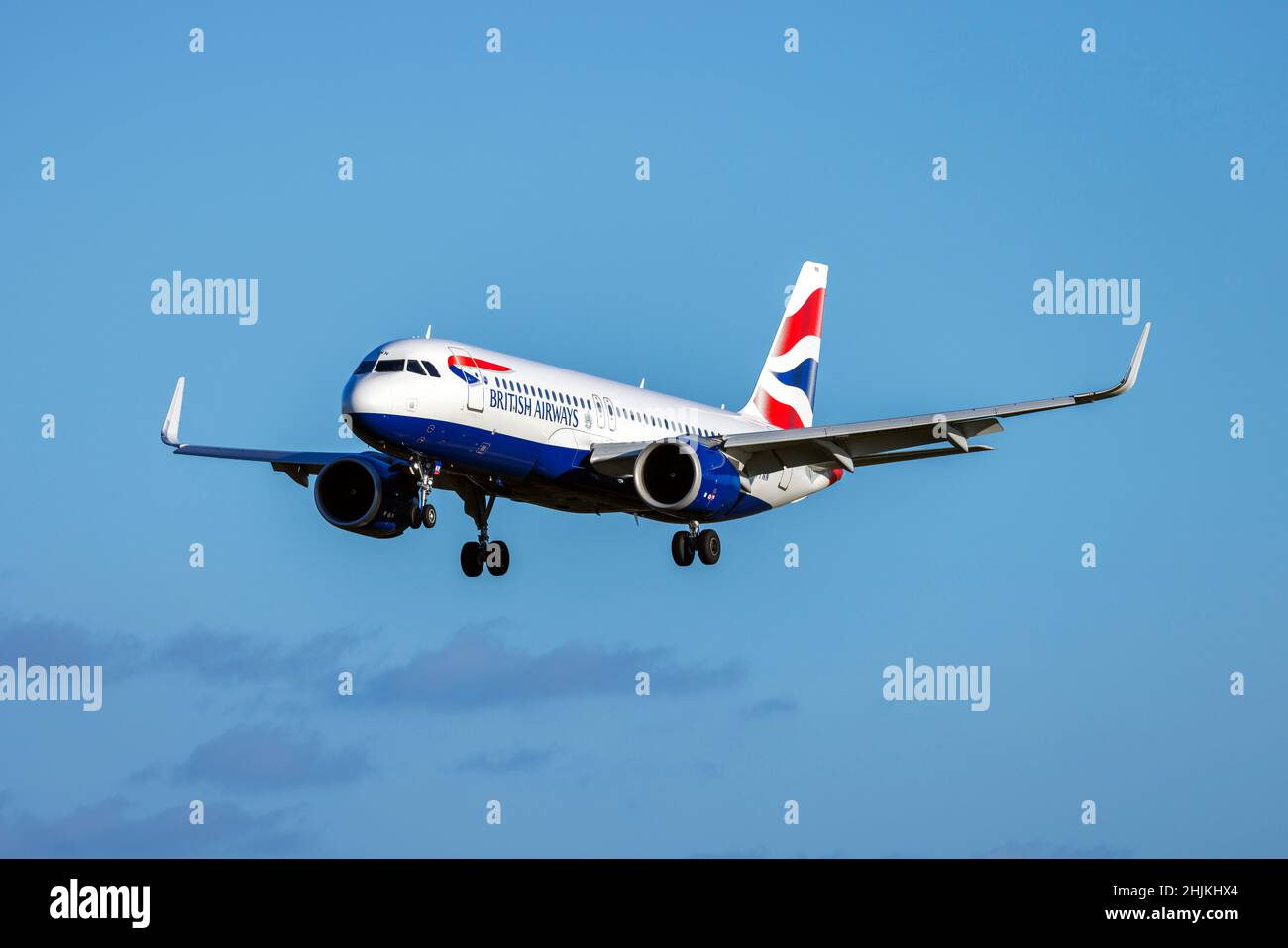 British Airways Airbus A320-251N (Reg.: G-TTNN) coming in for landing in the late evening. Stock Photo