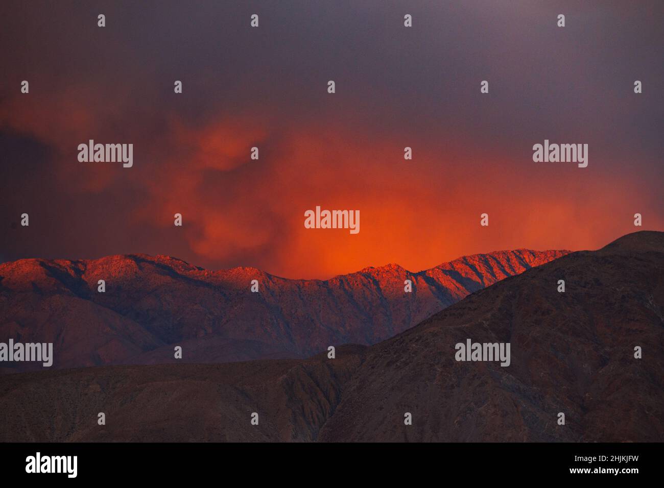 Red clouds at sunset over the Santa Rosa mountain range in Anza Borrego Desert State Park. Stock Photo