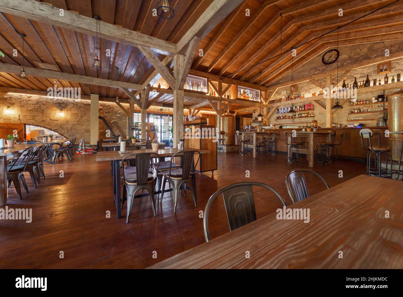 Interior of modern restaurant and bar with wooden ceiling Stock Photo