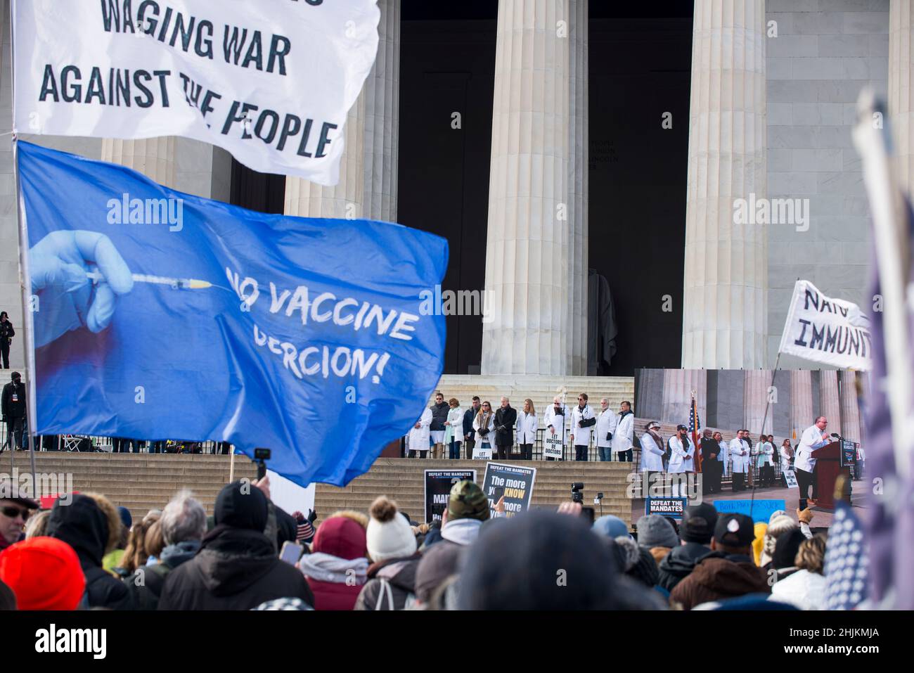 Defeat the Mandates march at Lincoln Memorial reflecting pool.Demonstrators protesting mask & Covid-19 vaccination mandates.Washington, DC,Jan 23,2022 Stock Photo