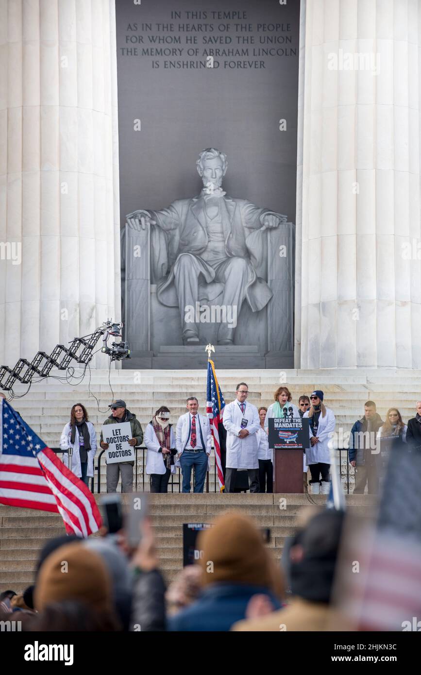 Defeat the Mandates march at Lincoln Memorial reflecting pool.Demonstrators protesting mask & Covid-19 vaccination mandates.Washington, DC,Jan 23,2022 Stock Photo