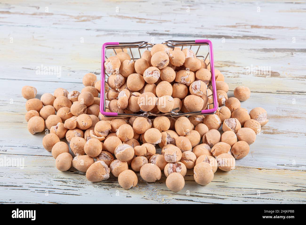 Soy sauce peanuts in a wooden bowl. Roasted Peanuts Coated with Soy