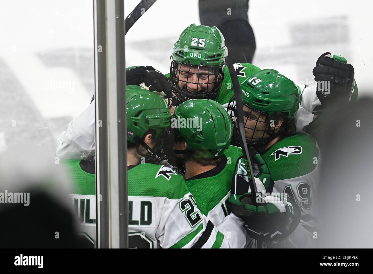 North Dakota Fighting Hawks defenseman Tyler Kleven (25) piles on a celebration pile after North Dakota scored a goal during a NCAA men's hockey game between the St. Cloud State University Huskies and the University of North Dakota Fighting Hawks at Ralph Engelstad Arena in Grand Forks, ND on Saturday, January 29, 2022. The game ended in a 3-3 tie and UND won a conference point by winning a shootout. By Russell Hons/CSM Stock Photo
