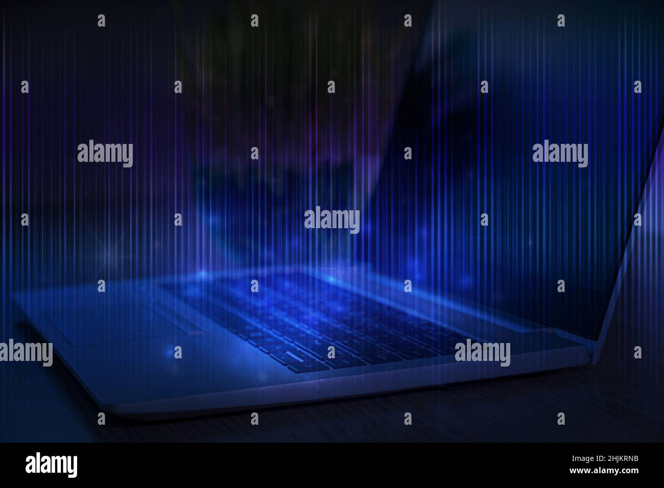 Technological background. Laptop with stripes of light on blue. Learn programming language, computer courses, training. Stock Photo