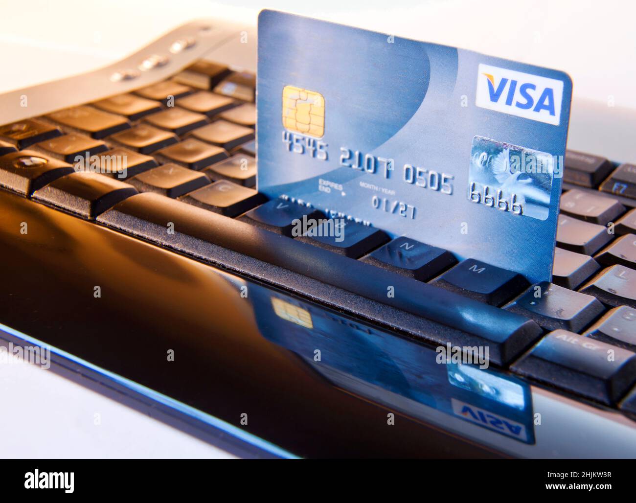 Web shop and credit card (numbers are changed). Keywords: pay buyer payment sale e-commerce order keys transaction transfer purchase booking booker se Stock Photo