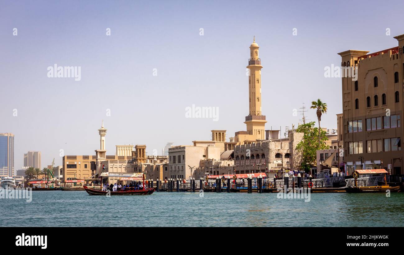 Dubai, UAE, 24.09.21. Old Dubai, Deira and Al Fahidi Historical District landscape view with Dubai Creek canal and wooden traditional abra boats. Stock Photo